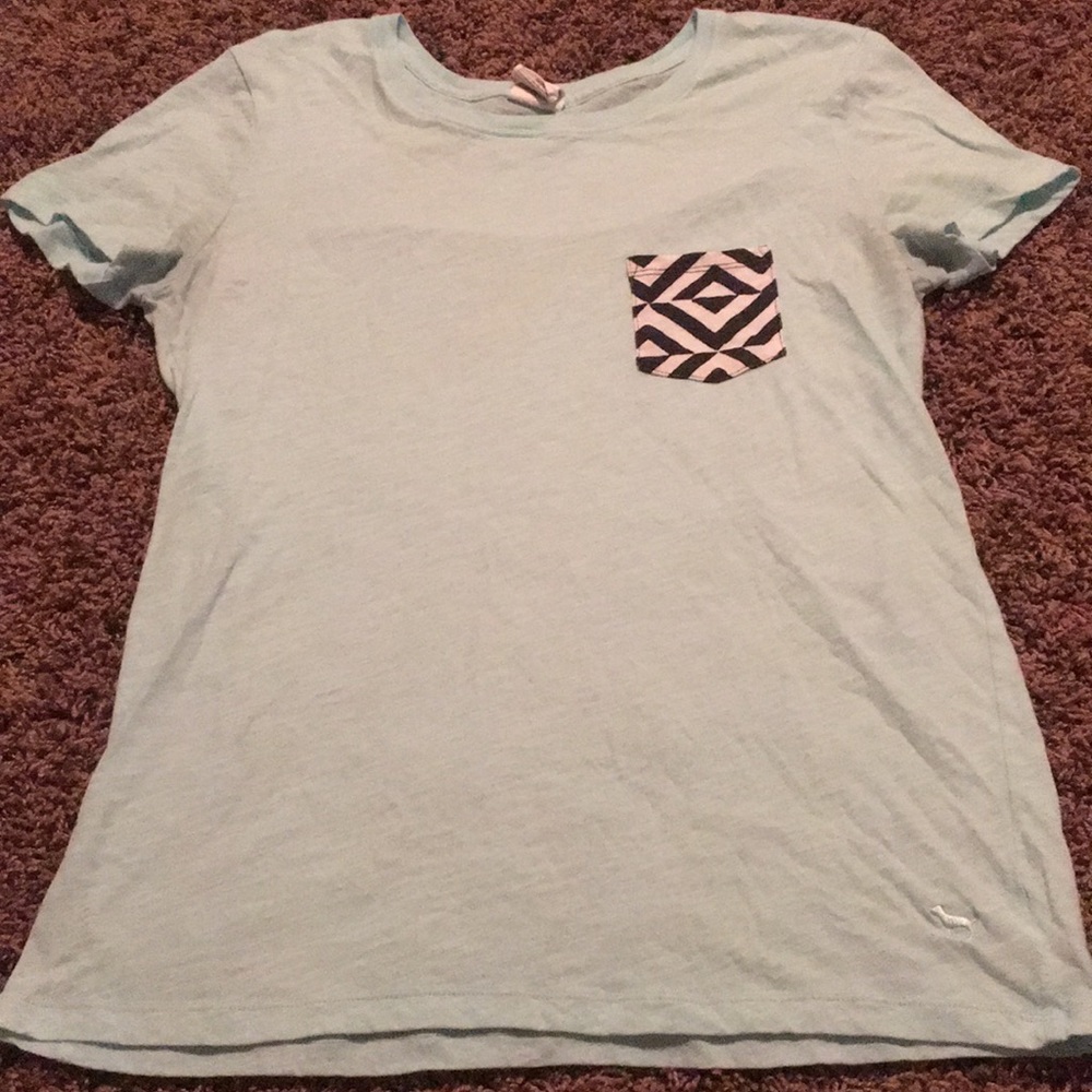 Light blue t-shirt with black and white pocket